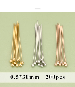 Close-up of 0.5x30mm metal ball head pins in gold, silver and rose gold for DIY jewelry