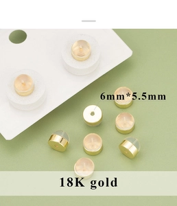 Detail of 6mm 18K gold plated hamburger earring backs with clear silicone casing