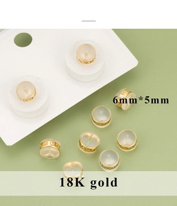 Detail of 18K gold MOM engraved earring backings with 6x5mm silicone inner plug