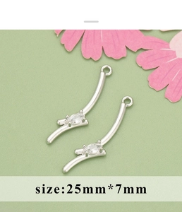 Macro shot of 18K gold plated bow zircon curved pendant for DIY earring jewelry making