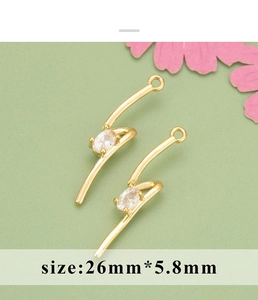 Close-up of 18K gold plated S-shape pendant with oval zircon and 26mm size marking