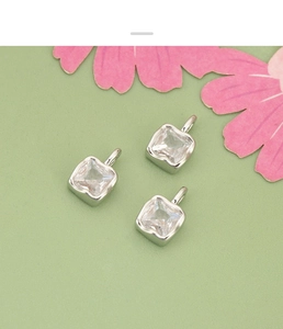 Three square-cut clear zircon pendants with silver settings and hanging rings for DIY jewelry