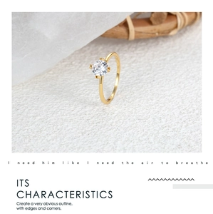 Macro shot of elegant six-prong gold ring with round brilliant cut diamond on natural background