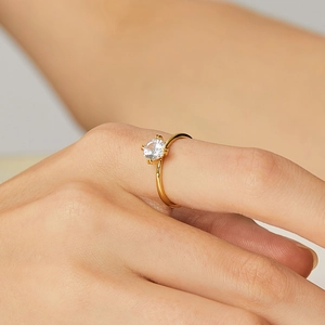 Elegant gold crown ring with a round zircon in a classic four-prong setting