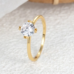Elegant four-prong crown wedding ring with a round zircon in a gold finish