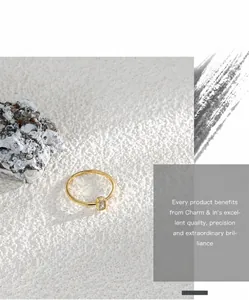 Primer plano de un anillo de oro minimalista con una piedra de circón rectangular elegante