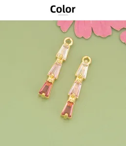 Macro view of 18K gold plated pendants with pink gradient cubic zirconia for DIY jewelry