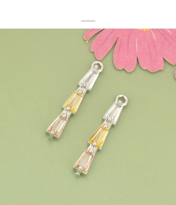 Macro view of 18K gold plated tiered trapezoid crystal pendants for DIY jewelry