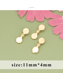Detailansicht vergoldeter Schleifen-Zwischenperlen für DIY-Schmuck in 11mm x 4mm