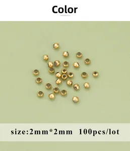 Macro shot of 100pcs 2mm gold-plated stainless steel spacer beads for DIY jewelry making
