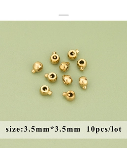 Macro shot of 3.5mm gold stainless steel jewelry stopper beads for DIY crafts