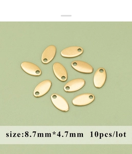 Detail of 10 matte gold oval spacer beads with 8.7x4.7mm size for DIY jewelry making
