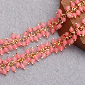 Macro detail of 18K gold plated beaded chain with translucent pink quartz beads for DIY