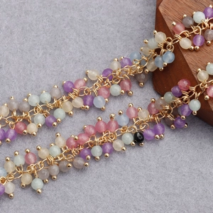 Detailed close-up of colorful 18K gold-plated beaded tassels for DIY jewelry crafting