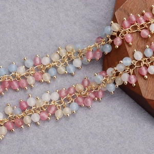 Detailed macro view of 18K gold plated beaded chain with colorful crystal beads