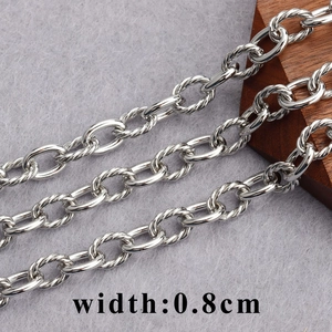Detail shot of 0.8cm wide 18K gold-plated metal chain with textured O-link design