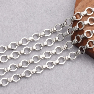 Macro view of silver O-shape and textured oval links for DIY jewelry chain making