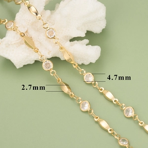 Detail of 18K gold-plated jewelry chain with 2.7mm oval links and 4.7mm zircon stones