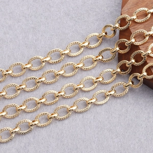 Macro view of 18K gold plated chain with alternating smooth and textured oval links