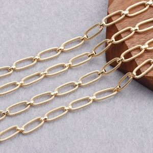 Detailed close-up of 18K gold-plated oval link chain with unique twisted texture for DIY