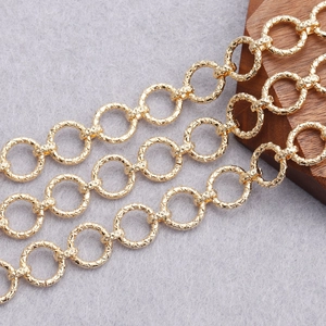 Macro shot of 18K gold plated textured O-ring chain links for DIY jewelry making