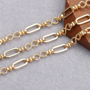 Detailed macro view of 18K gold plated O-shaped and twisted infinity link DIY chains
