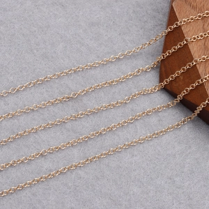 18K gold plated round cross chain for DIY jewelry making on a grey background