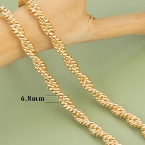 6.8mm 18K gold plated rope chain on wooden branch background for DIY jewelry making