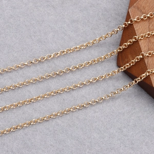 Polished 18K gold-plated round link chain jewelry diy material on grey velvet backdrop