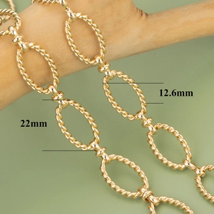 Detailed view of 22mm x 12.6mm gold-plated twist oval chain links for DIY jewelry