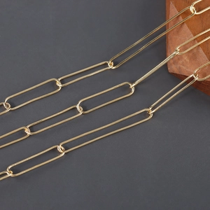 Detailed close-up of 18K gold-plated brass paperclip chain links for DIY jewelry making
