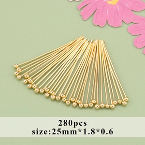 Macro shot of 280pcs 18k gold plated ball pins 25mm for DIY jewelry making crafts