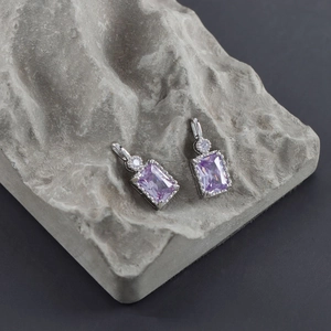 18k gold plated earring dangle with rectangular purple zircon on textured stone base