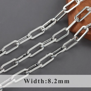 Macro shot of 8.2mm silver paperclip chain links with polished finish and width measurement