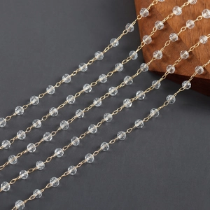 Macro view of 18k gold plated chains with faceted crystal beads for DIY jewelry