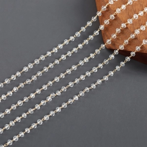 Macro shot of 18k gold plated chain with faceted crystal beads for DIY jewelry making