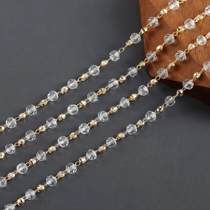 Macro shot of 18k gold plated faceted beads and clear crystals for jewelry making