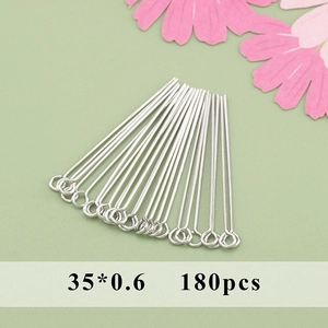 Macro detail of 35x0.6mm rhodium plated eye pins for DIY jewelry making in a 180pcs pack