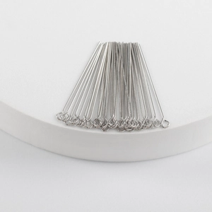 Polished silver rhodium plated eye pins for jewelry making on white display base