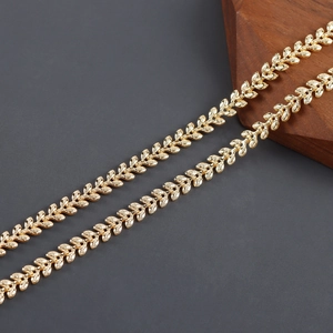 Detailed macro shot of 18k gold-plated leaf-shaped link chain for DIY jewelry making