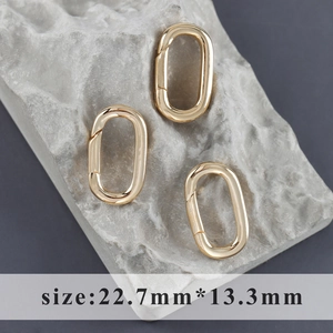 Chiusure a moschettone ovale placcate oro 18k su pietra grigia, misura 22.7x13.3mm