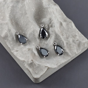 Detail of water-drop black zircon pendants with silver plated four-prong setting for DIY