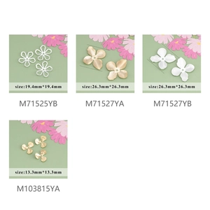 Detail view of four assorted 18k gold-plated flower spacers and floral jewelry findings