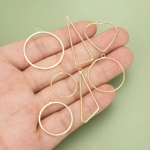 18k gold-plated geometric charms in round, triangle, and heart shapes for DIY jewelry making