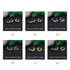 Close-up of assorted 18k gold-plated zircon hoop earrings for DIY jewelry making