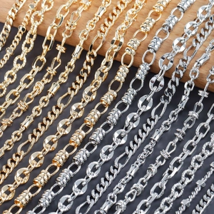 Macro view of assorted 18k gold and rhodium plated DIY punk hip-hop chain textures