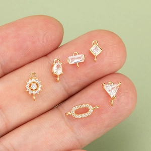 Gold plated geometric mini zircon pendants set for DIY jewelry making on model finger