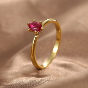 Luxury gold plated brass ring with oval red zircon and pavé crystals on champagne silk