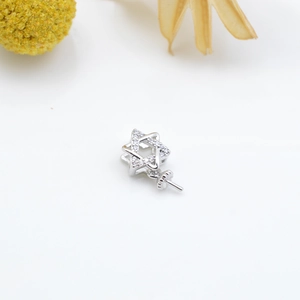 Macro view of silver star micro-set pendant base with clear zircon stones for DIY jewelry