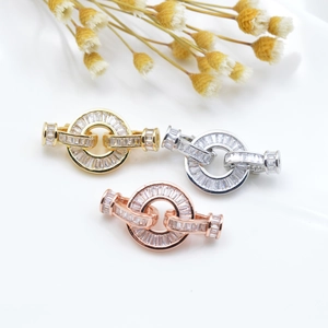 Detailed view of micro-paved cubic zirconia jewelry clasps in gold silver and rose gold